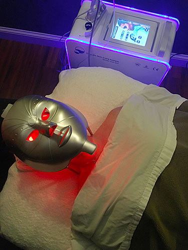 Oxy facial machine and mask on client.
